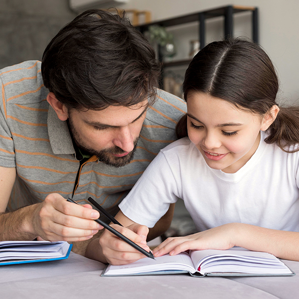 father-teaching-girl-write